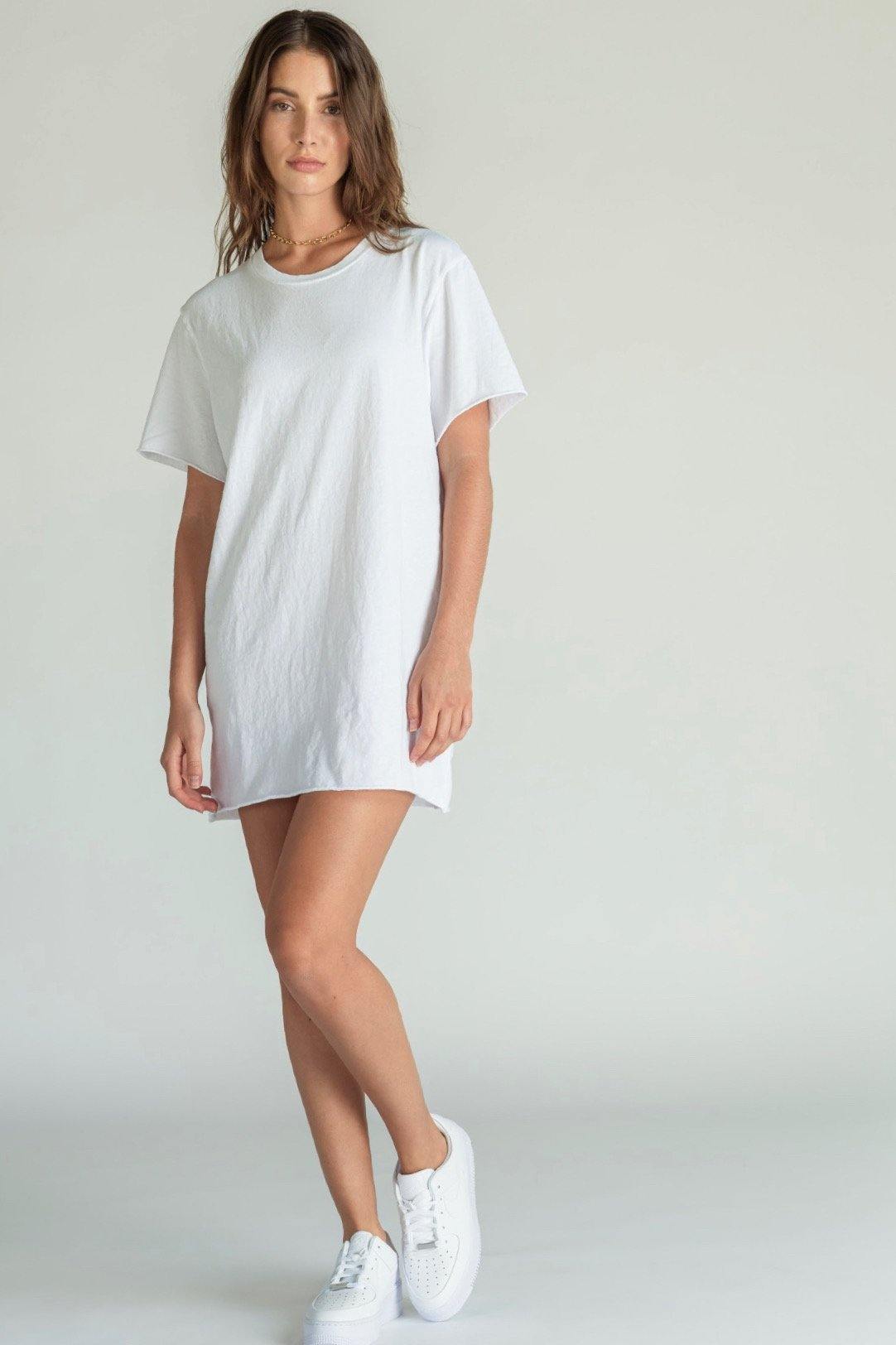 This super soft mini dress feels like a vintage concert tee. The perfect tee-shirt made into a dress with a raw hem and sleeve. Easy to wear, day to night, night to day. 100% crisp cotton. Many perfectly curated hues to choose from. Pictured in White.