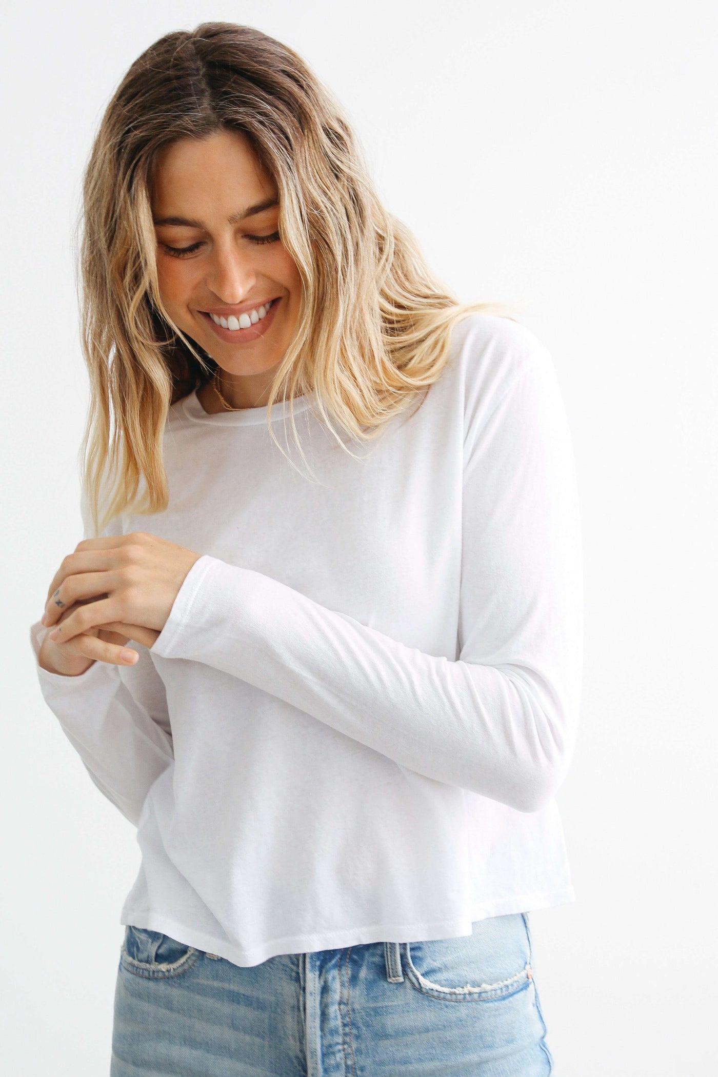 Axel is the perfect women's long sleeve crew neck boxy tee. Color: White. Just boxy enough and 100% crisp cotton. A variety of sizes & colors available. Buy now!
