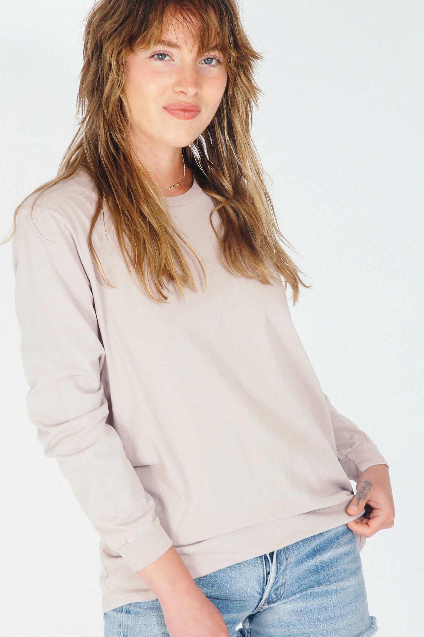 This is the perfect long sleeve cotton tee. Available in several colors (pictured in Mauve Mist). Buy now!  Edit alt text