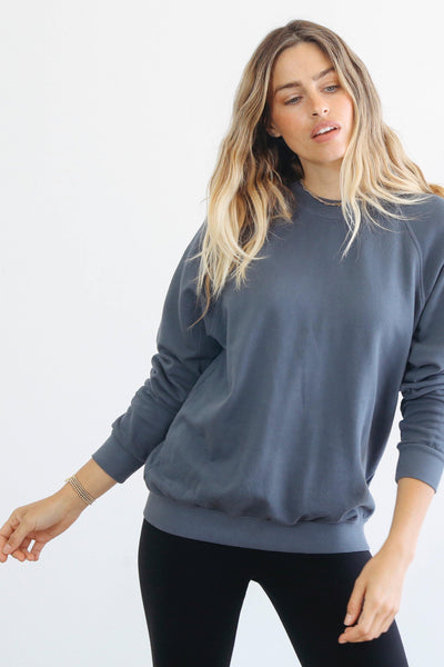 The perfect slightly oversized sweatshirt.  Longer length so it's easy with leggings, or perfectly paired with our Nash joggers. Made with 100% cotton french terry. This sweatshirt has a classic fit and vintage feel. Pictured in Night (slate blue grey.)