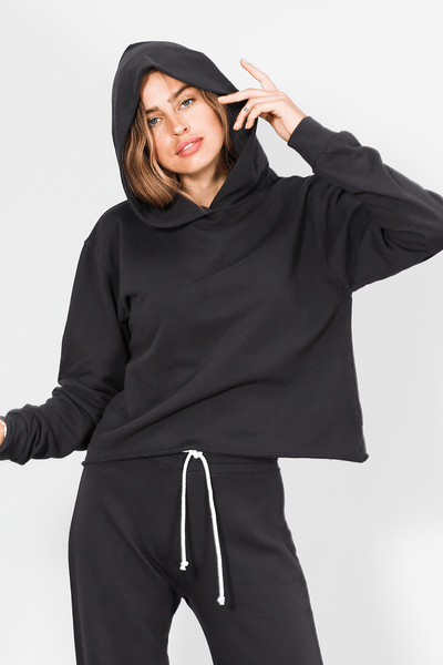 Meet your new favorite hoodie made from our signature french terry cotton, this lined hoodie is super soft and roomy enough to be comfortable. the perfect fit, with a cut off raw hem at the bottom. Pictured in Vintage Black